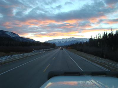 sunset image through windshield of peterbilt